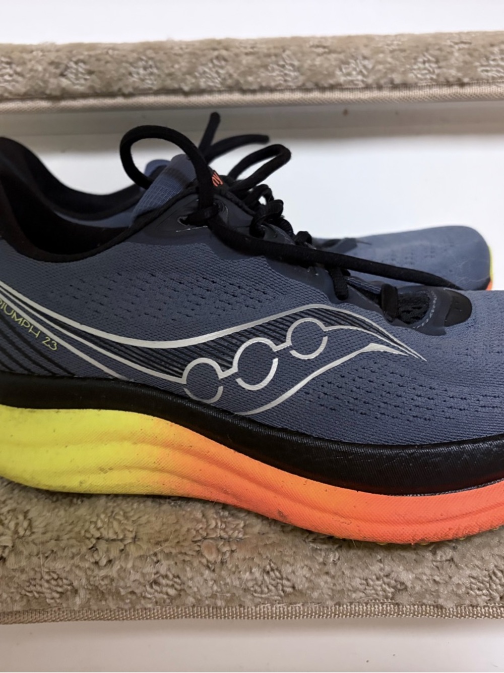 Saucony Men’s Blue Running Shoes with Yellow and Orange Gradient Sole